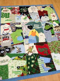 there is a very large patchwork quilt made to look like it has many different sweaters on it