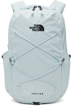 Water-resistant non-PFC DWR-coated canvas backpack in blue. · Padded carry handles · Adjustable padded shoulder straps · Press-release sternum strap · Reflective loop at straps, face, and sides · Logo and text embroidered at face · Criss-crossing bungee-style drawstring · Mesh patch pocket at sides · Padded and quilted FlexVent™ back face · Two-way zip closure · Two-compartment interior · Mesh and zip pockets at interior · Padded laptop compartment · H18 x W10 x D6 / 22L Supplier color: Ice blue/TNF black Blue School Bag, Grey North Face Backpack, Blue Northface Backpack, North Face Jester Backpack Aesthetic, North Face Jester Backpack, Functional Blue The North Face Backpack, Blue The North Face Outdoor Bag, North Face Jester, North Face Bag