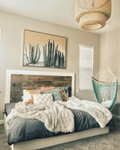 a bedroom with a hammock hanging from the ceiling and a bed in the middle