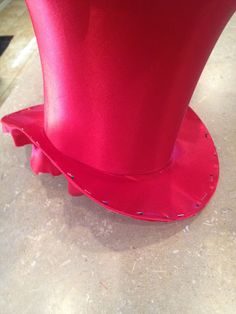 a red top hat sitting on top of a table