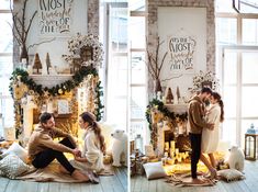 a couple is sitting on the floor in front of a christmas tree and fire place