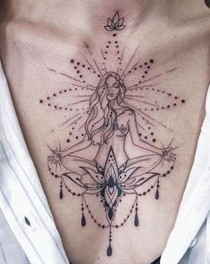 a woman's chest with an intricate tattoo design on her stomach and the back