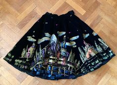 Hand painted mexican skirt with sequins.  Original Mexican skirt with beautiful hand-painted scenes and embellished with sequins. Heavy black velvet fabric. This skirt is in such a small size that was even too small for my mannequin. Very nice condition and she is really beautiful but therefore suitable for the smaller size. She is measured flat; waist 30 cm/ 11,8 inch (can shift 1 cm/ 0,39 inch  with the hooks) length 58.5 cm/ 23 inch She closes with hooks on the side that can be moved a centim Mexican Skirt, Mexican Skirts, Black Velvet Fabric, Full Circle Skirt, Full Circle Skirts, Full Circle, Circle Skirt, Beautiful Hand, Velvet Fabric