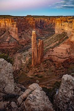 the canyon is surrounded by large rocks and cliffs