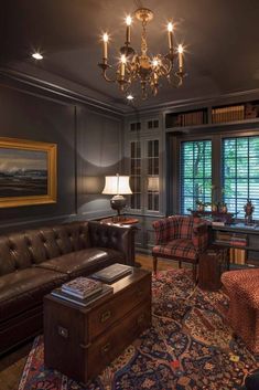 a living room filled with furniture and a chandelier