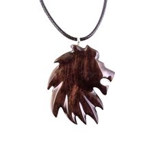 an animal's head is shown on a necklace