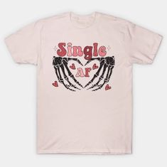 a pink t - shirt with the words single art on it and two hands holding hearts