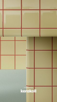 two different colored tiles with red and white lines on the wall next to each other