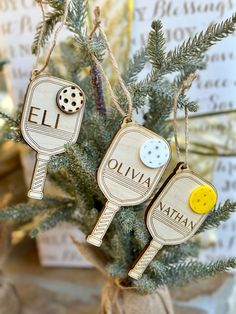 two tennis racquets ornament hanging from a christmas tree