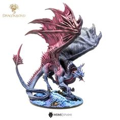 a purple and black dragon figurine on a white background