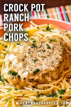 crock pot ranch pork chops on top of spaghetti