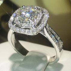 an engagement ring with diamonds on display at a jewelery store in the united states