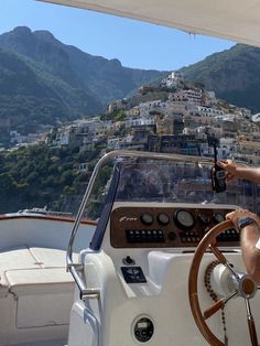 a man driving a boat in the water