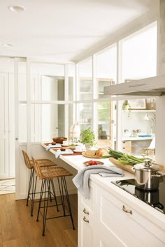 the kitchen counter is clean and ready to be used as a breakfast bar or oven