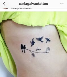 a woman's stomach with birds on it