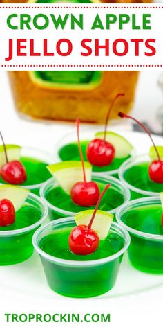 small cups filled with green jello shots and cherries