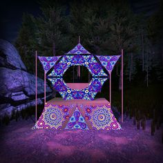 an artistic display in the middle of a forest at night with purple lights and trees