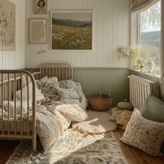 a bed sitting in a bedroom next to a window filled with pillows and other items