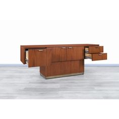 an office desk with two drawers in the middle