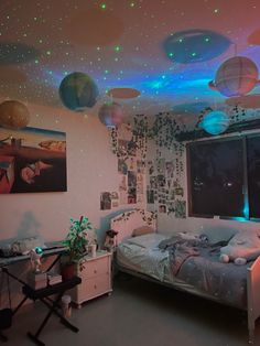 a bedroom with lights on the ceiling and bed