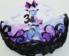 I offer you a beautiful outfit in the style of Vampirina. The outfit is made of quality materials so as not to damage the baby's skin. NOTES FOR THE SELLER -Number for personalizing the top. -Name to personalize the vertex. -Need by date. Sleeve for the top - short, long. TOP. The top of it is 100% cotton. Size 3-24 months it is a bodysuit, 2T-10T it is a shirt. (Since it is more handmade always remember the shirt needs to be washed inside out, hand washed and air dried). SKIRT - made of soft tu Minnie Mouse Tutu Outfit, Frozen Tutu Dress, Elsa Tutu, Minnie Mouse Tutu, Girls Birthday Party Dress, Birthday Tutu Outfit, Ballerina Birthday