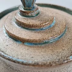 a close up of a blue and brown pot