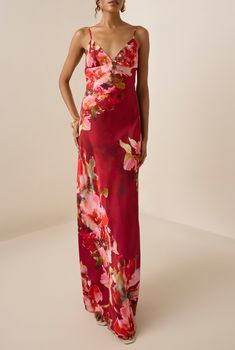 From the Resort '25 Collection, the Tuhi Satin Long Dress exudes sleek sophistication. Crafted from polyester satin lycra in a rich dark red hue with a delicate floral print, this fitted long dress features a plunging V-neck and elegant spaghetti straps. A discreet side zipper closure ensures a seamless fit. A stellar choice for those starry nights and vacay vibes. Made In India Dark Red Floral Print Polyester Satin Lycra V-Neck Spaghetti Straps Side Zip Closure Fitted All Over Dry Clean Only Th Red Floral Dresses, Square Neck Floral Dress, Fitted Long Dress, Jeans Long Skirt, Satin Long Dress, Long Fitted Dresses, Vacay Vibes, Hemant And Nandita, Satin Dress Long