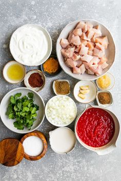 the ingredients to make this dish are arranged in separate bowls on a gray table top