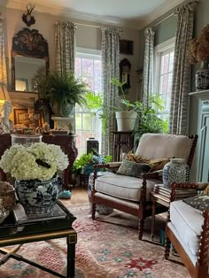 a living room filled with furniture and flowers