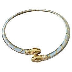 A wonderful Vintage Cartier 18 K Gold Cougar Panthere Necklace, sumptuously hand-made in Cartier's Parisian workshop in the late 1990s. This piece features three colours of 750 (18 K) yellow, white and rose gold wire, wrapped around a gold solenoid, finished with a pair of sculpted panther heads in yellow gold. The epitome of elegance, this Cartier Panthere Cougar Necklace showcasing the iconic Panthere motifs crafted in 18k yellow Gold. The necklace is crafted in stainless steel with bands of 1 Luxury Cartier Necklace With Polished Finish, Classic Cartier Luxury Necklace, Panther Necklace, Cartier Necklace, Cartier Panthere, Elizabeth Taylor, Gold Wire, Matching Bracelets, White Rose Gold