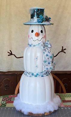 a snowman made out of plastic sitting on top of a table