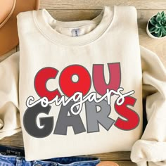 a pair of jeans and a t - shirt with the words cou congrats gar on it