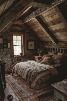 an attic bedroom with stone walls and exposed ceiling, made up of wood planks