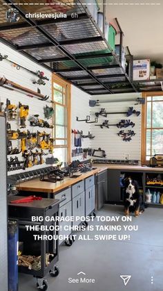 an image of a garage with tools on the wall and shelves full of tools hanging from the ceiling