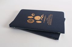 two passport covers sitting on top of each other