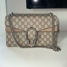 Dionysus Gg Small Shoulder Bag - Worn Twice, No Damage, Looks Brand New, Has Receipt And Original Box & Bag. Purchased From Gucci Store In December 2023. Style 400249 Khnrn 8642 A Structured Gg Supreme Canvas Bag With Our Textured Tiger Head Closure-A Unique Detail Referencing The Greek God Dionysus, Who In Myth Is Said To Have Crossed The River Tigris On A Tiger Sent To Him By Zeus. The Sliding Chain Strap Can Be Worn Multiple Ways, Changing Between A Shoulder And A Top Handle Bag. Beige/Ebony Gucci Dyonisus Bag, Gucci Dionysus Bag, God Dionysus, Gucci Bag Dionysus, Luxury Bags Collection, Gucci Store, Gucci Purse, Gucci Purses, Greek God