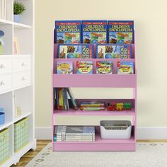 a blue book shelf with books on it in a child's playroom area