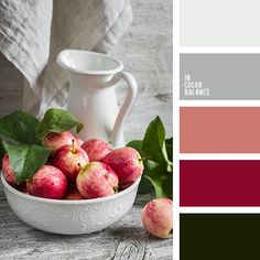 apples in a white bowl with green leaves on the side and color palette swatches