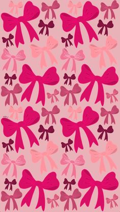 pink and red bows are arranged in the shape of hearts on a light pink background