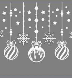 christmas ornaments hanging from strings with snowflakes and stars