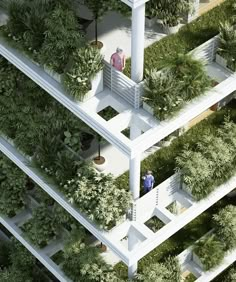 an aerial view of a building with plants growing on the walls and balconies