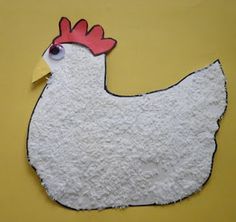 a white chicken with a red comb on its head is cut out of paper and placed on a yellow background