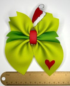 Christmas mean one Grinch hair bow on alligator clip.  Made with neoprene fabric.  All bows are ready to ship and ship out the next day! Please go join our facebook group "Little Southern Creations" to be the first to see our new products! Grinch Hair, Les Arcs, Neoprene Fabric, Barrette Clip, Facebook Group, Barrettes, Hair Bow, Grinch, New Products