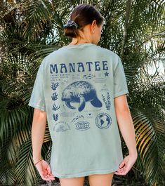 Show your love for the Manatees with our manatee-themed tee! Perfect for the manatee and nature lovers; it blends facts about these amazing creatures with a message for marine preservation. Wear it proudly and let's make waves for our adorable underwater friends!  Comfort Colors 1717 Unisex Tee : * High quality, 100% ring-spun US cotton that is ethically grown and harvested * Direct-to-garment (DTG) prints * Available in multiple size S to 4XL * The relaxed fit keeps you comfy and make it an exc Marine Biology Shirts, Biology Shirt, Anatomy Shirts, Respect The Locals, Save The Ocean, Mermaid Top, Ocean Aesthetic, Manatees, Beach Tee