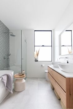 a bathroom with two sinks and a bathtub