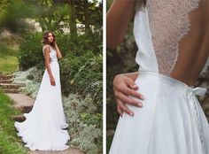 a woman in a white wedding dress standing next to some bushes and trees with her hand on her hip