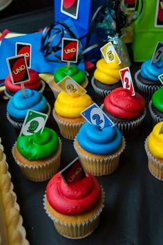 cupcakes with colorful frosting and numbers on them