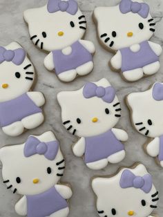 hello kitty cookies are arranged on a table