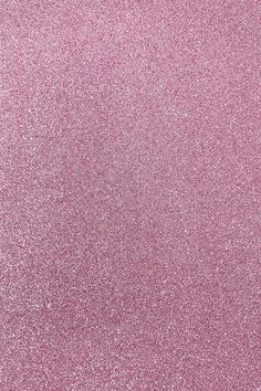 a pink glitter background that is very shiny