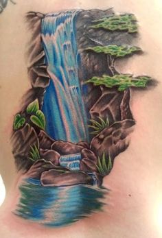 a man with a waterfall tattoo on his back